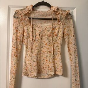 Floral Ruffle Blouse in Cream by [Brand]